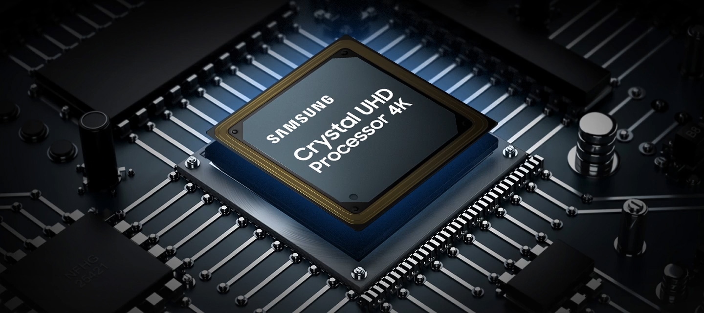 A Samsung Crystal UHD Processor 4K chip is laid out on a TV's main board with glowing power lines.
